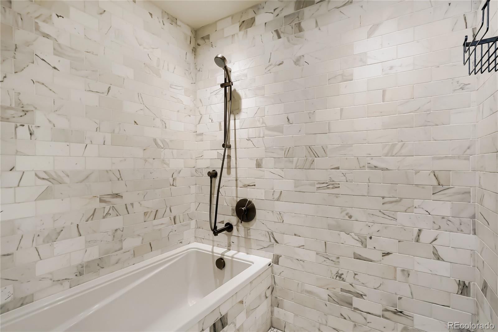 1750 Wewatta Street, Unit 403 Denver, CO 80202 - Photo 19 of 40 a bathroom with a bathtub