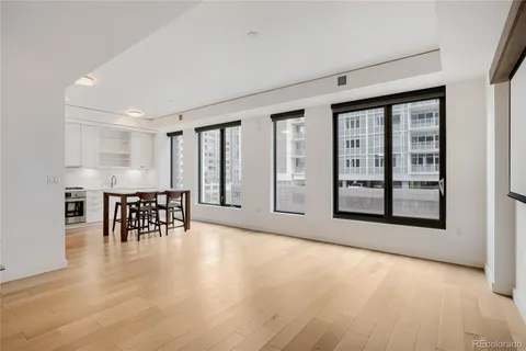 an empty room with furniture and a window