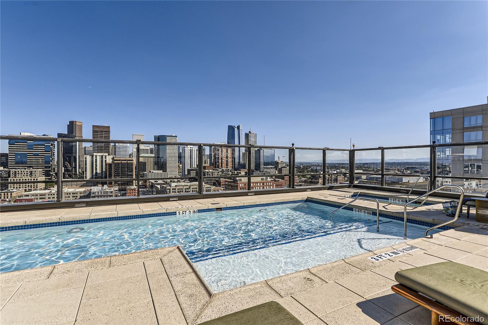 1750 Wewatta Street, Unit 403 Denver, CO 80202 - Photo 25 of 40 a view of a terrace with wooden benches