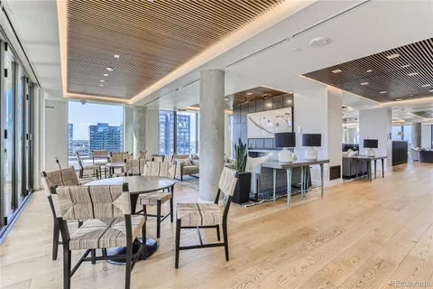 a kitchen with stainless steel appliances a sink stove refrigerator and cabinets