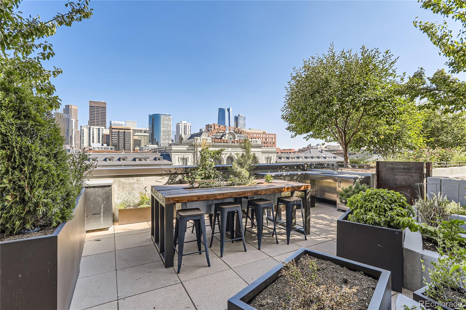 1750 Wewatta Street, Unit 403 Denver, CO 80202 - Photo 34 of 40 a view of a chairs and table in the terrace