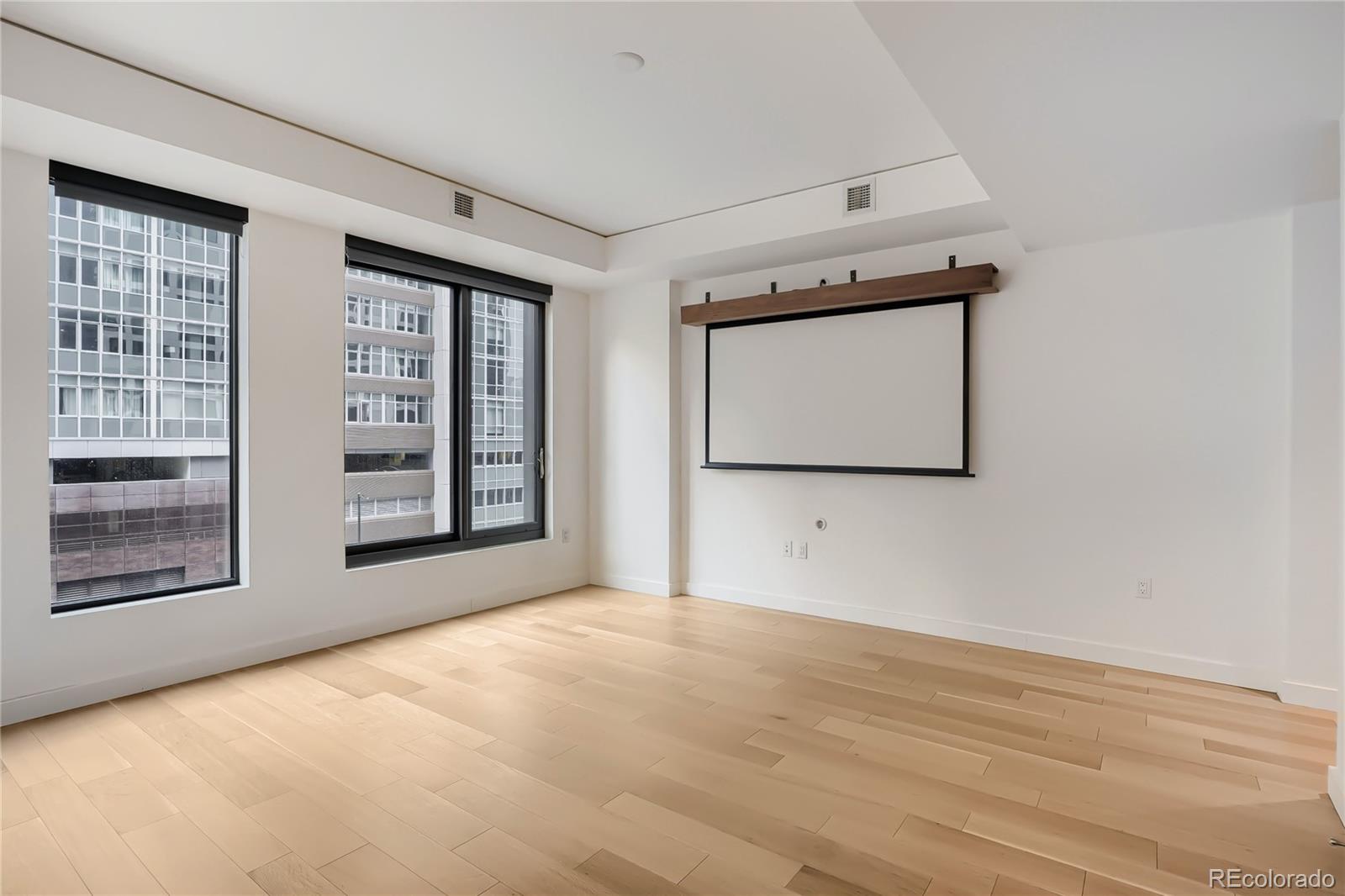 1750 Wewatta Street, Unit 403 Denver, CO 80202 - Photo 7 of 40 an empty room with windows
