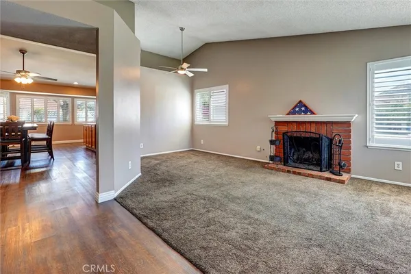 wooden floor fireplace and dining room in a livingroom