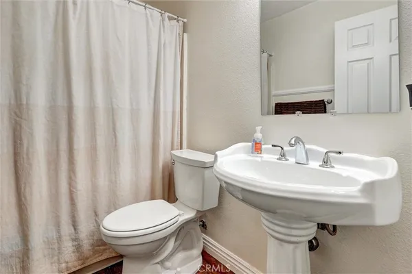 a white sink sitting next to a white sink