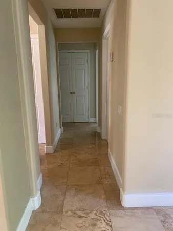 a view of a hallway with a glass door