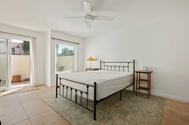 a bedroom with a bed and a table