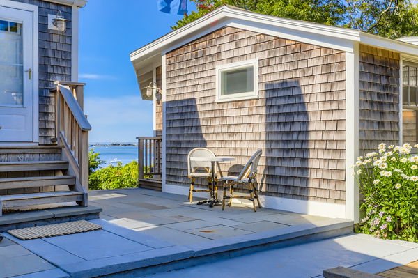 217 Barnes Road Oak Bluffs, MA 02557 - Photo 38 of 60 a front view of a house with outdoor seating