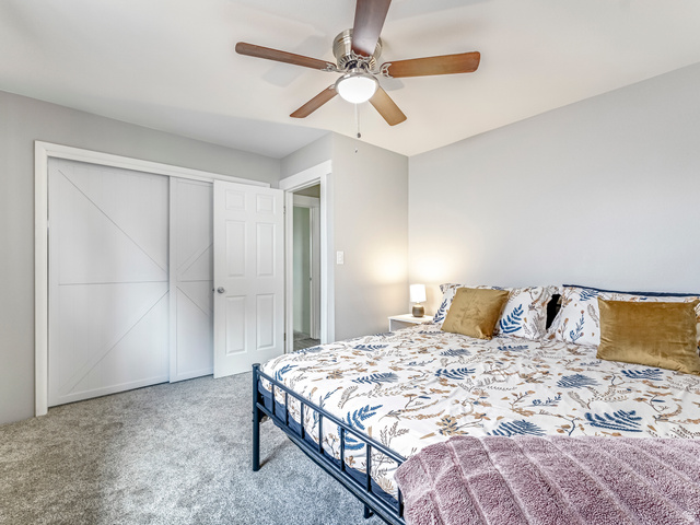 523 South Main Street Payson, UT 84651 - Photo 21 of 41 Carpeted interior with light grey walls, white trim, and a ceiling fan with integrated lighting