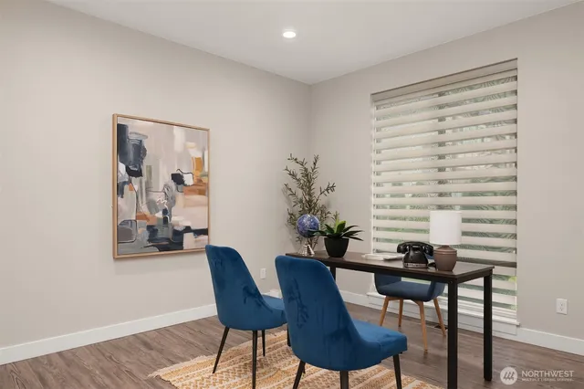 a view of a livingroom with furniture and a potted plant