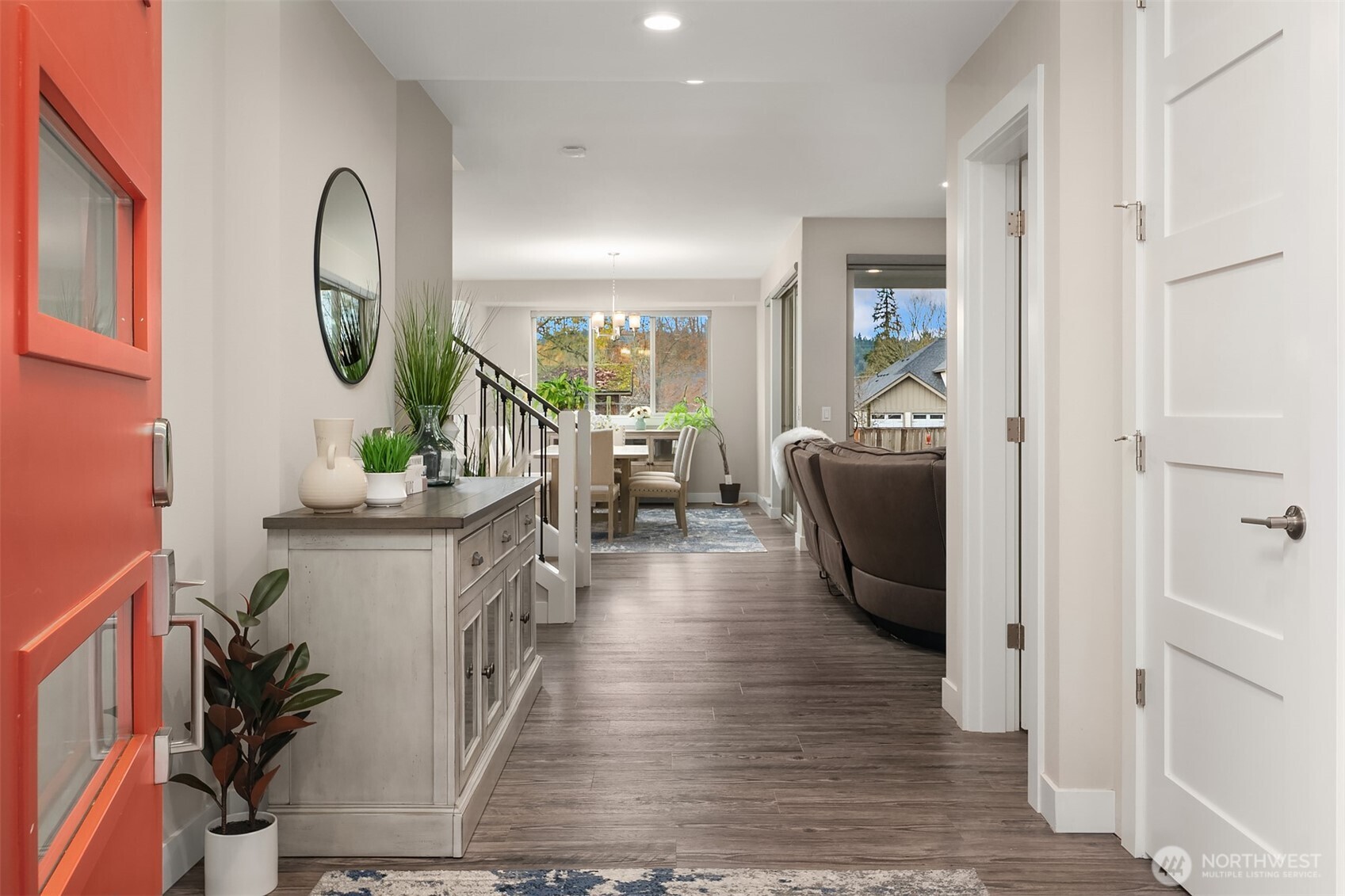 4529 327th Place Northeast Carnation, WA 98014 - Photo 2 of 27 a living room with furniture a mirror and a wooden floor