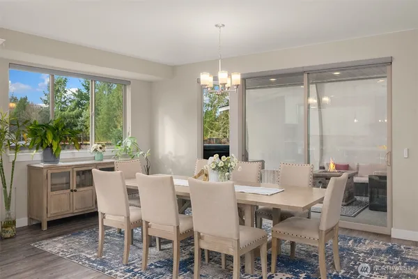 a view of a dining room with furniture window and outside view