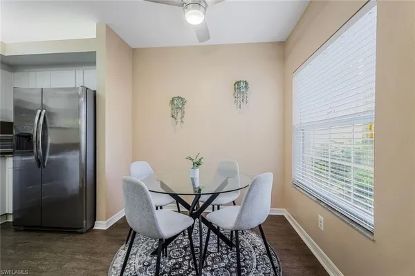 a view of a dining room with furniture window and outside view