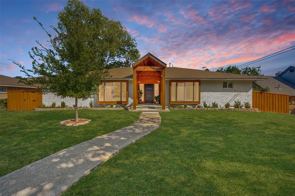 View of front facade featuring brick siding