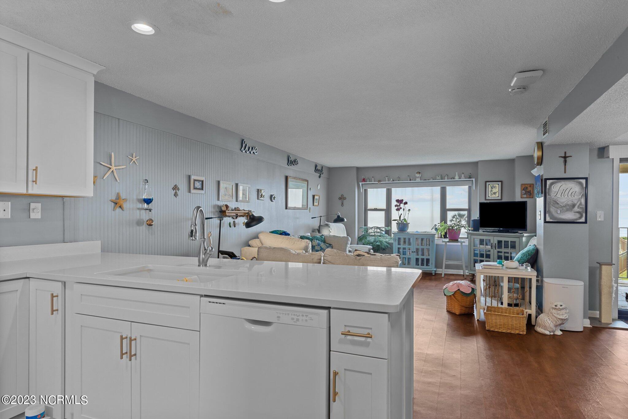 1505 Salter Path Road, Unit 238 Indian Beach, NC 28512 - Photo 5 of 49 open kitchen and living area