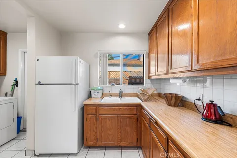 a view of kitchen and utility room with washer and dryer