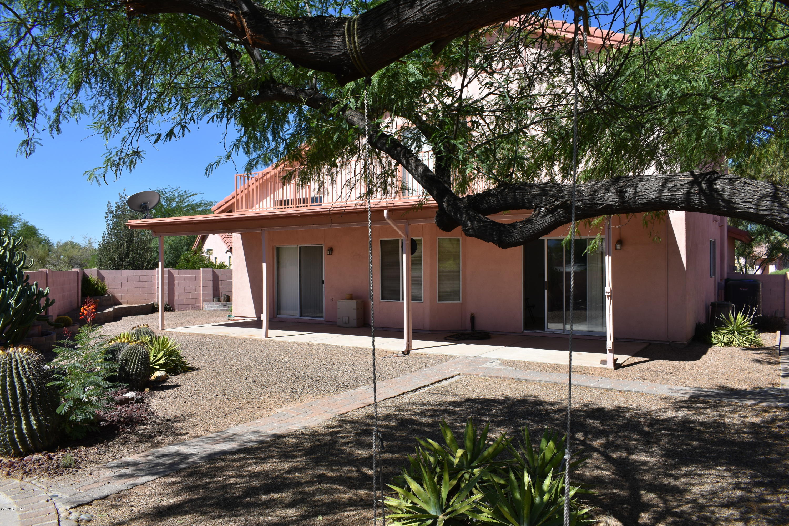 3504 West Sky Ridge Loop Tucson, AZ 85742 - Photo 8 of 13 a front view of a house with a garden
