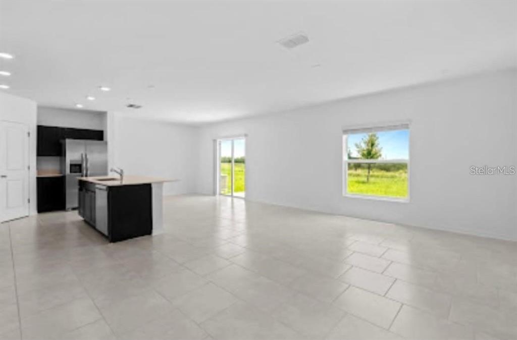 669 Reggie Road Winter Haven, FL 33859 - Photo 2 of 23 a view of kitchen and a window