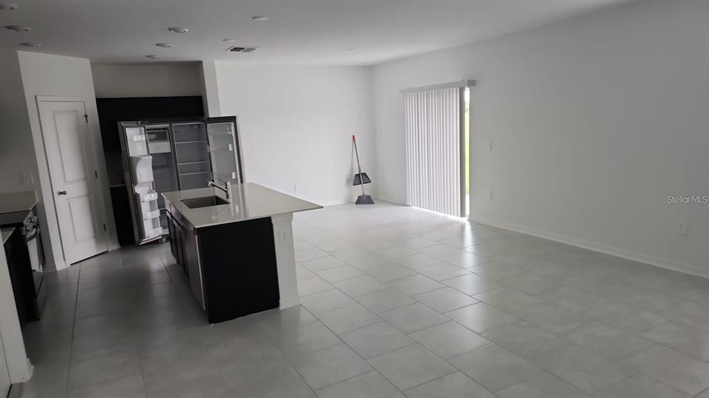 669 Reggie Road Winter Haven, FL 33859 - Photo 6 of 23 wooden floor in an empty room