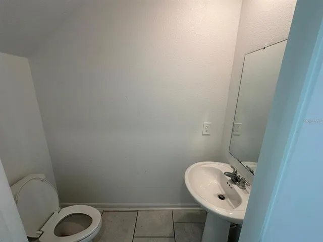 a bathroom with a sink and toilet