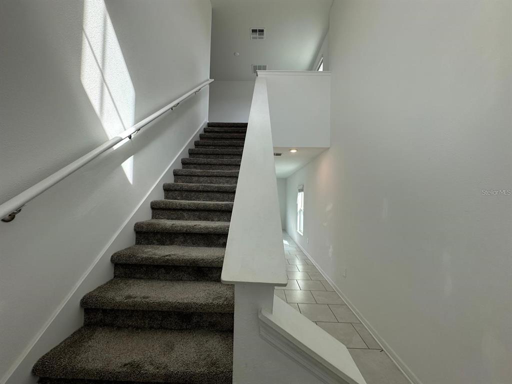 669 Reggie Road Winter Haven, FL 33859 - Photo 8 of 23 a view of entryway and hall with wooden floor