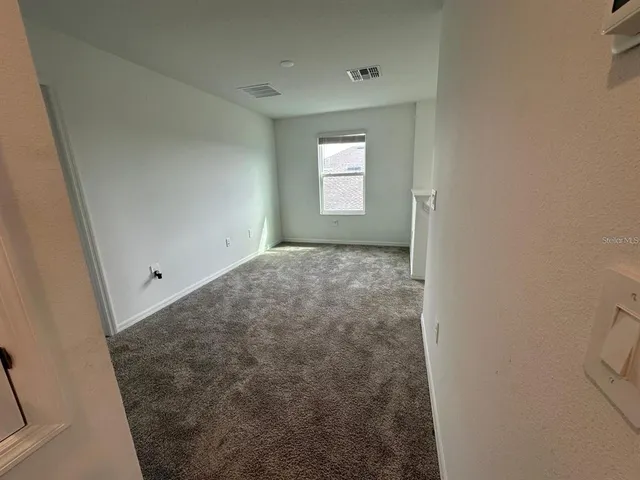 a view of a window in an empty room