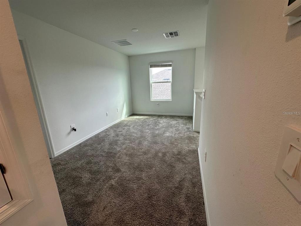 669 Reggie Road Winter Haven, FL 33859 - Photo 10 of 23 a view of a window in an empty room