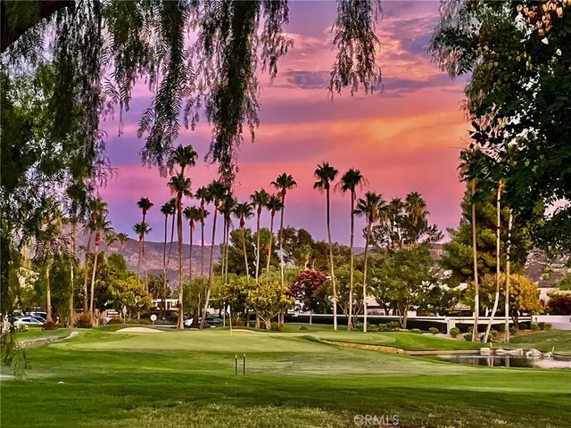 a view of a porch with furniture and garden