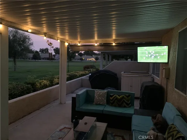 a outdoor living space with furniture and garden view