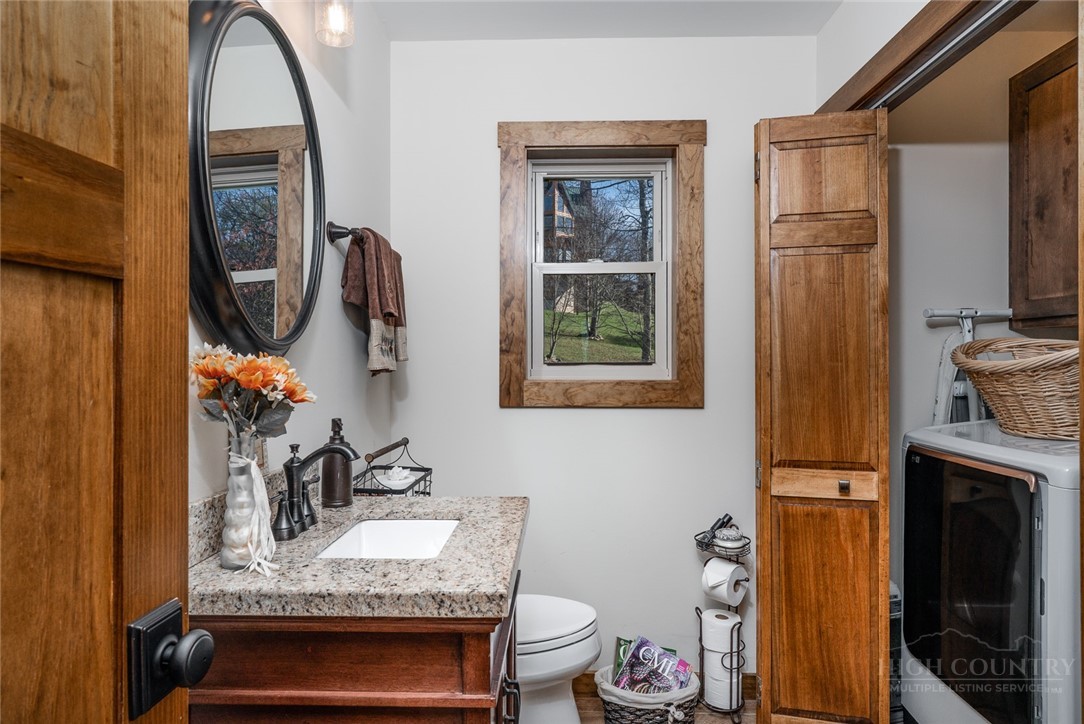 1161 Grandview Dr Extension Boone, NC 28607 - Photo 13 of 43 a bathroom with a granite countertop toilet sink and mirror