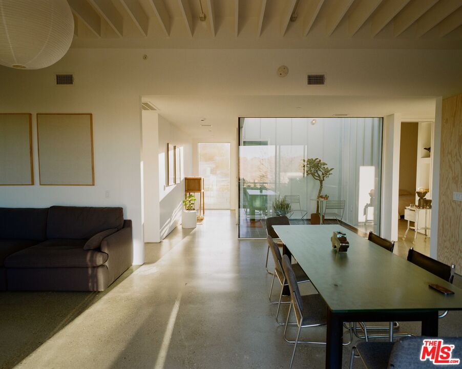 7825 Conejo Avenue Joshua Tree, CA 92252 - Photo 13 of 34 a view of a dining room with furniture and window