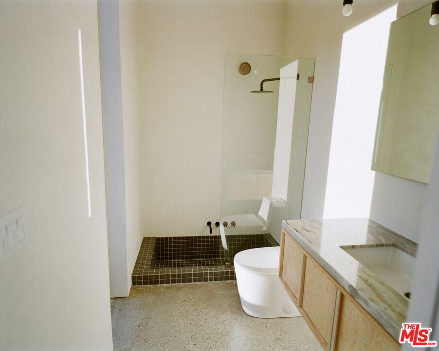 7825 Conejo Avenue Joshua Tree, CA 92252 - Photo 16 of 34 a bathroom with a sink and a mirror