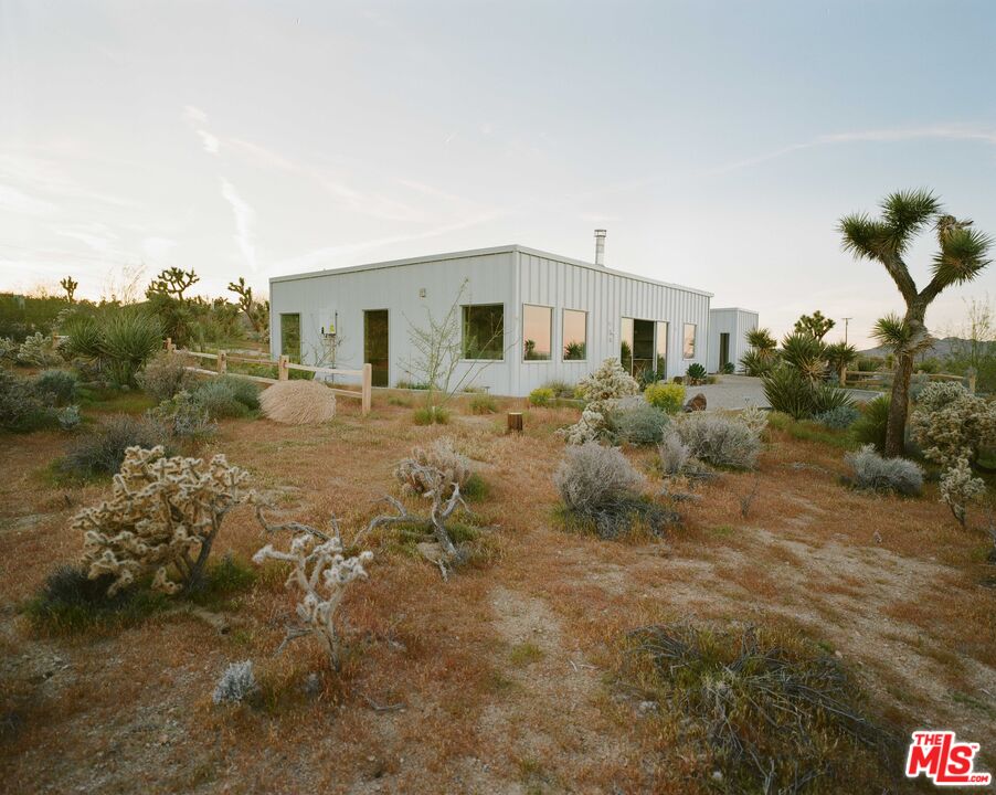 7825 Conejo Avenue Joshua Tree, CA 92252 - Photo 2 of 34 a view of a yard in front of the house
