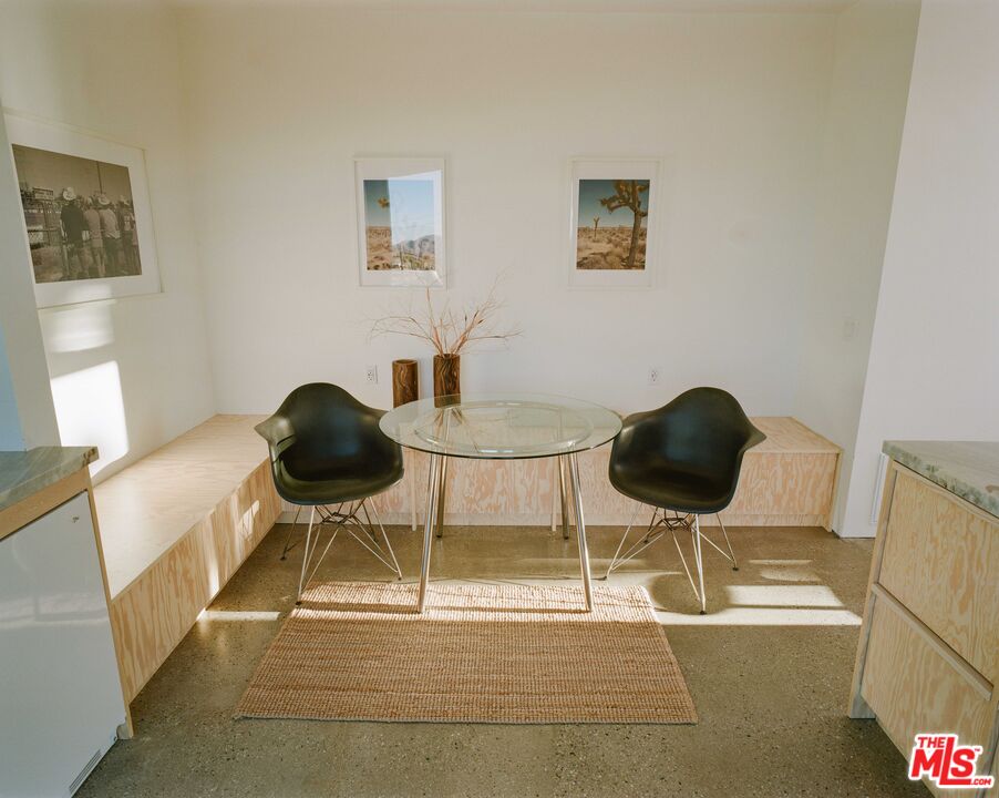 7825 Conejo Avenue Joshua Tree, CA 92252 - Photo 28 of 34 a table and chairs in a room