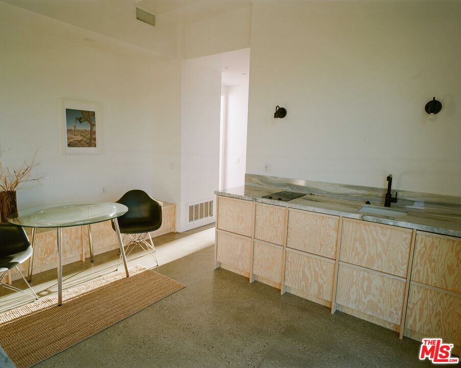 7825 Conejo Avenue Joshua Tree, CA 92252 - Photo 29 of 34 a kitchen with a sink and cabinets