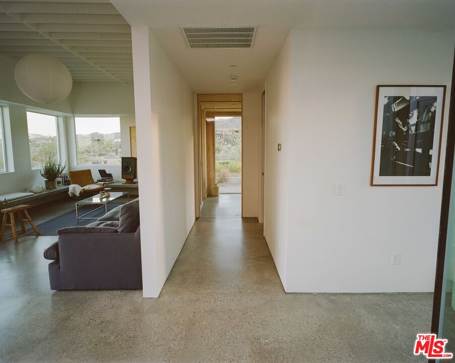 7825 Conejo Avenue Joshua Tree, CA 92252 - Photo 5 of 34 a view of a living room with furniture and a window