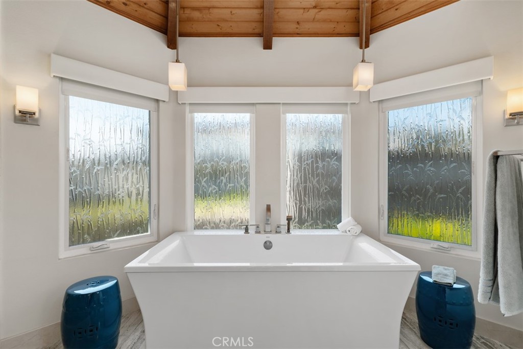 33901 Orilla Road Dana Point, CA 92629 - Photo 17 of 57 a white bath tub sitting in a bathroom next to a window