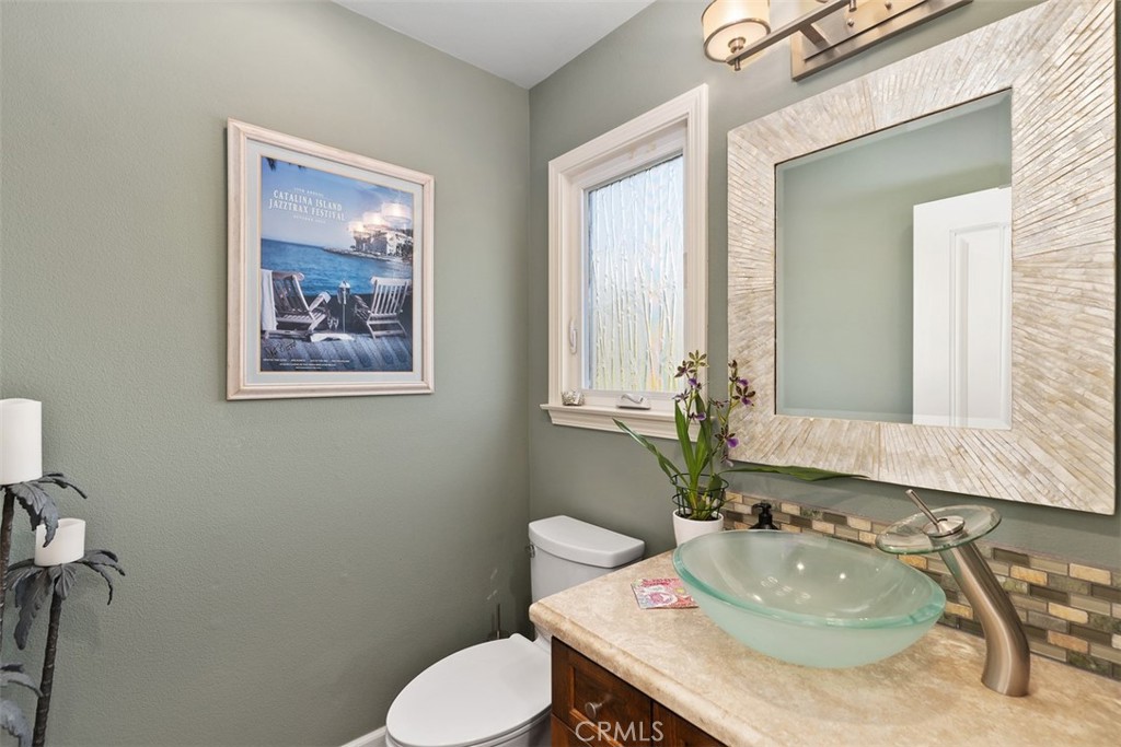 33901 Orilla Road Dana Point, CA 92629 - Photo 38 of 57 a bathroom with a toilet sink and mirror