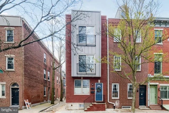 a bricked building with multiple windows