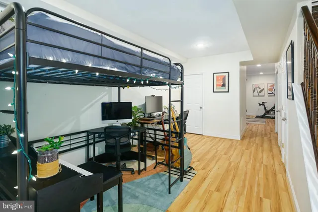 a dining room with furniture and wooden floor