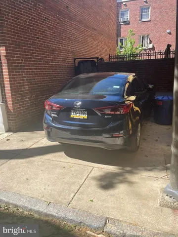 a view of a balcony with car parked