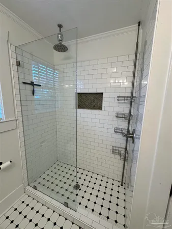 a bathroom with a shower and a sink