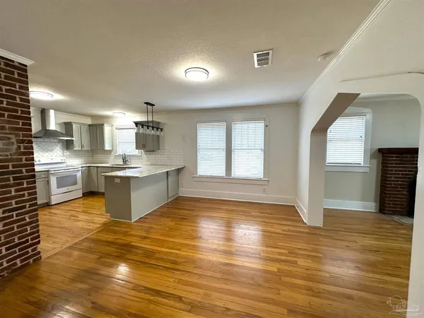 a view of kitchen with wooden floor
