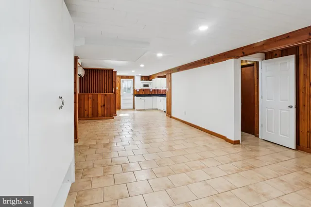 a view of an empty room with a couch