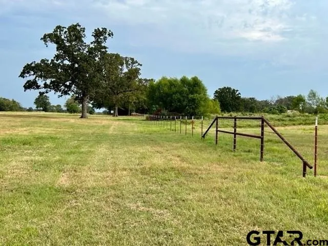 a view of a golf course with an trees