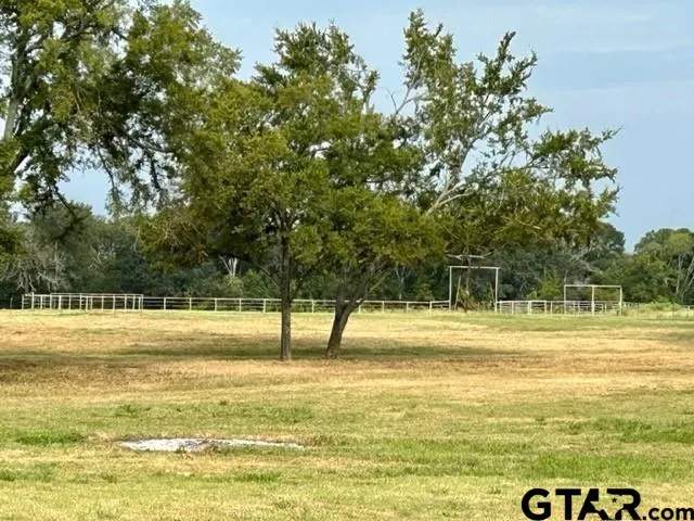 a view of a swimming pool with an outdoor space and seating area