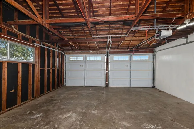 a bathroom with a sink a toilet and shower curtain