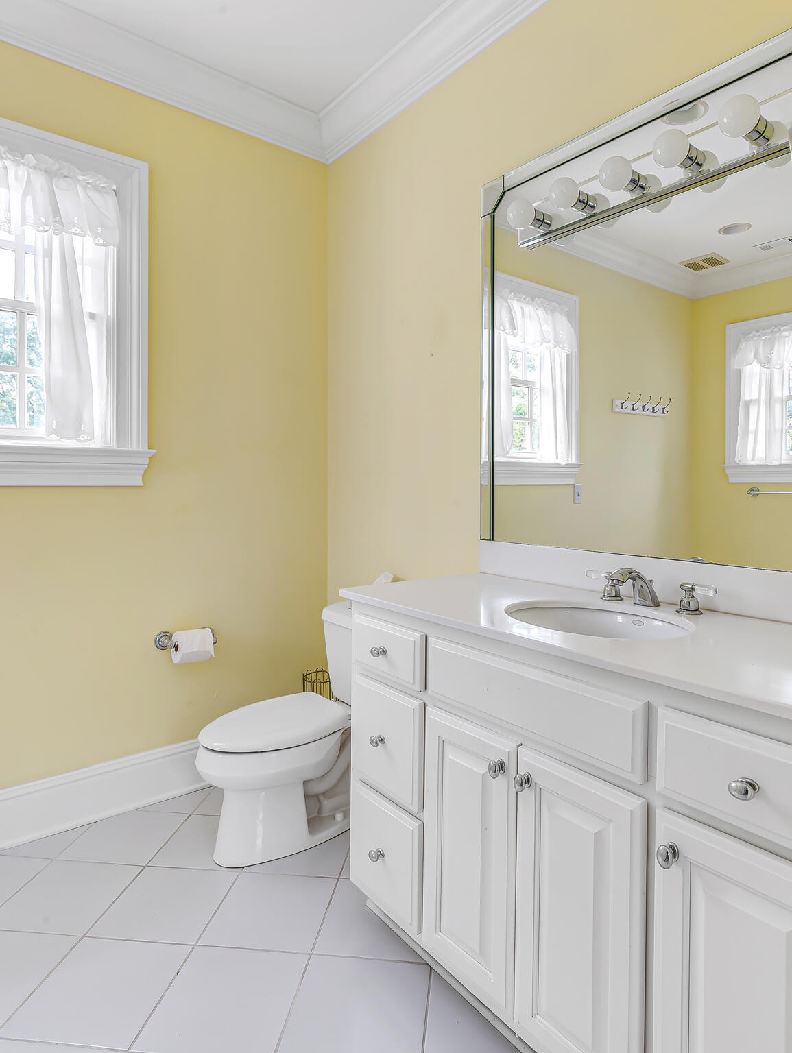3705 Trimble Road Nashville, TN 37215 - Photo 32 of 42 a bathroom with a sink a toilet and a mirror