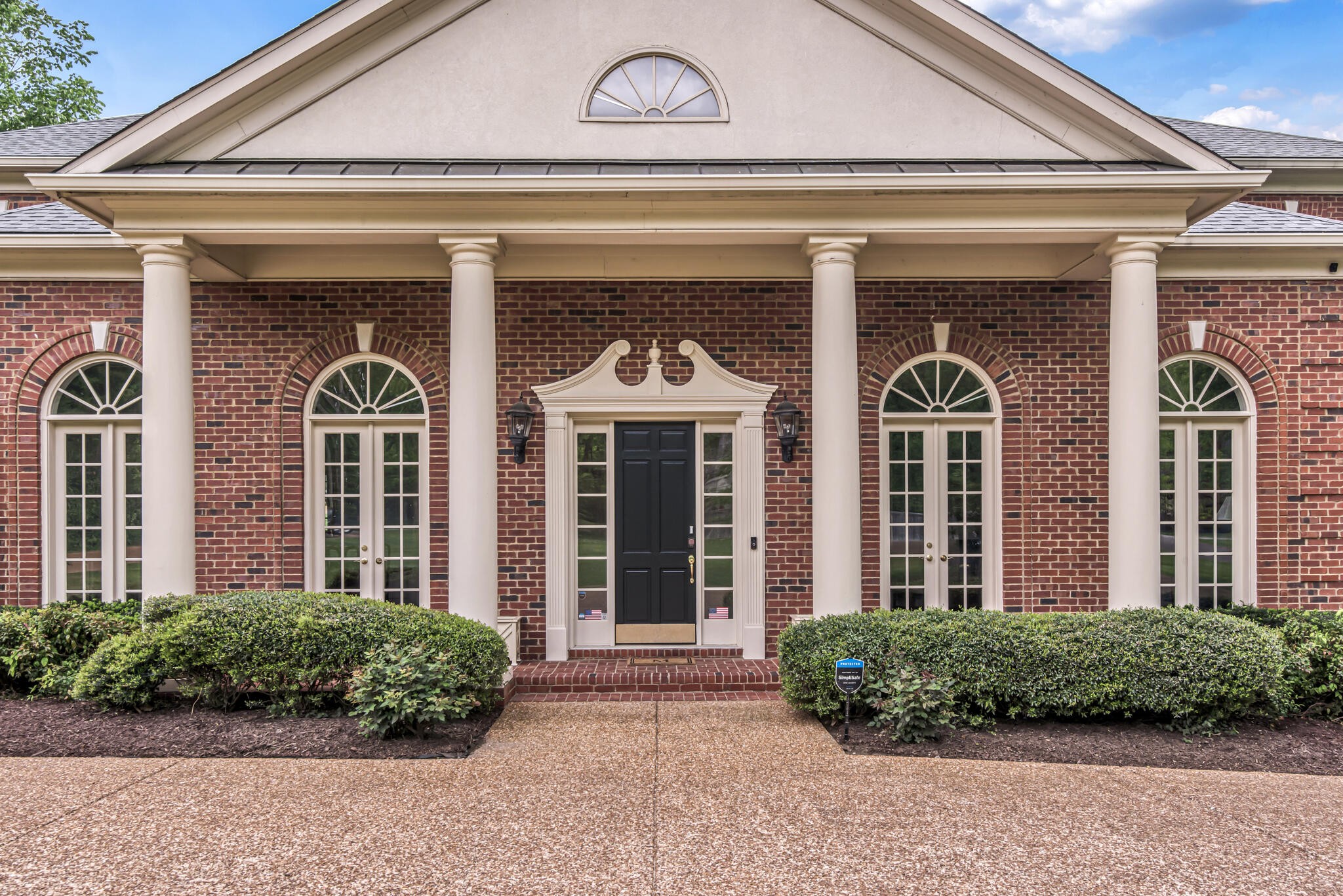 3705 Trimble Road Nashville, TN 37215 - Photo 4 of 42 a front view of a brick house with a large windows
