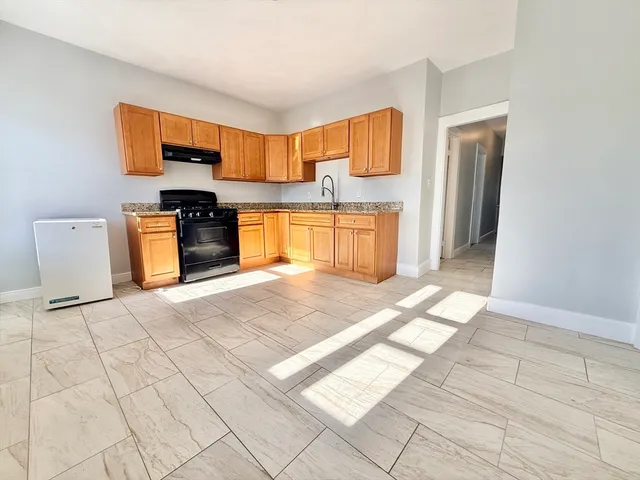 a view of a kitchen with furniture and a kitchen