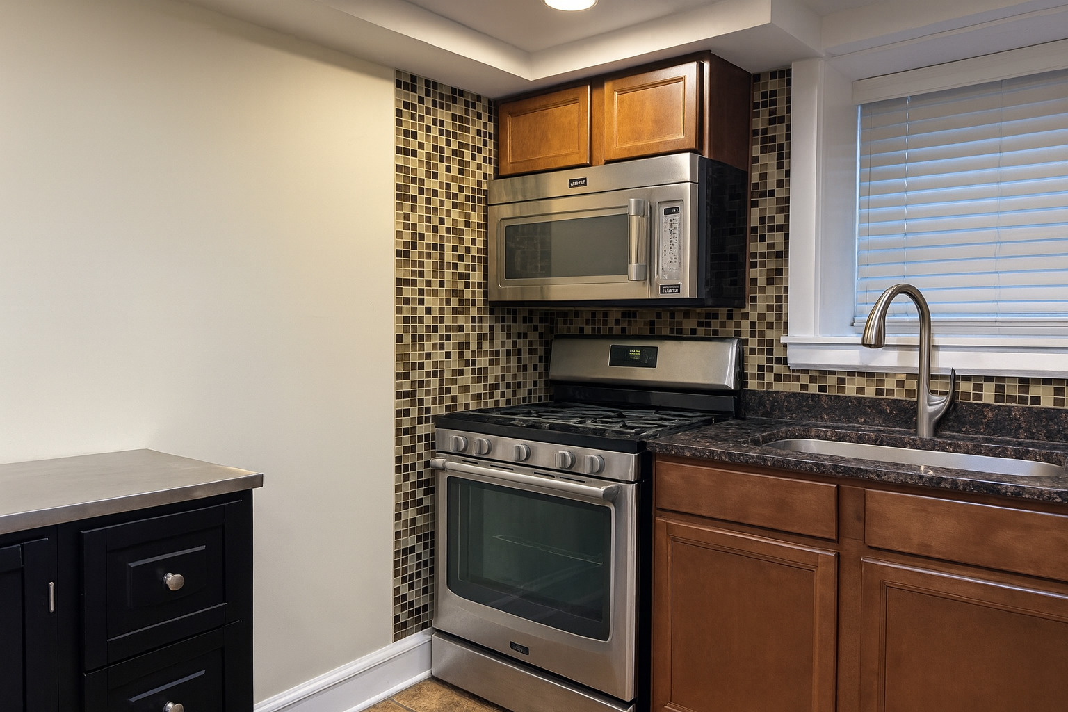 207 West Quincy Street, Unit GARD Riverside, IL 60546 - Photo 8 of 15 a kitchen with granite countertop a sink stove top oven and microwave